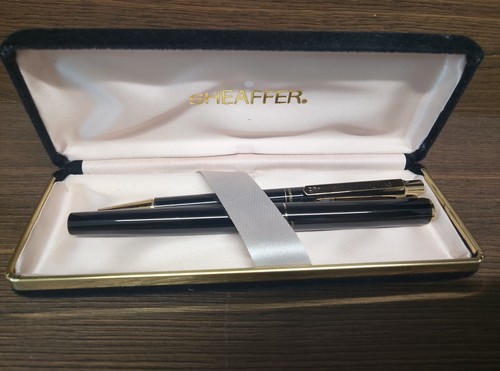 Two sheaffer pens - two, case.